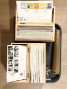 Two wooden boxes containing a collection of Royal Mail first day covers,