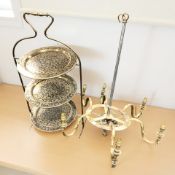 An enameled brass three tier cake stand and a brass light fixture.