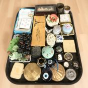 A group of dressing table items including compacts,