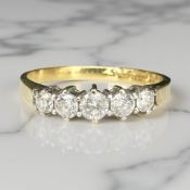 An 18ct gold five stone diamond ring, size Q CONDITION REPORT: 2.