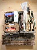 A group of vintage tennis rackets, fire bellows, furs, two carved ebony elephants, wicker basket,