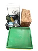 A wicker hamper, plastic trays, modern table lamp, tin plate model of a jeep, recycling bags, etc.
