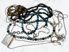 A group of silver and other necklaces,