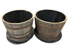 A pair of coopered oak barrel planters, diameter 65 cm,