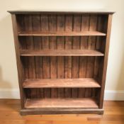 A stained pine open bookcase,