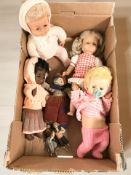 A group of vintage dolls.