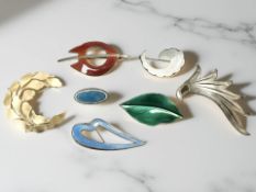 Four various Danish and Norwegian silver and enamel brooches, to including three in red,