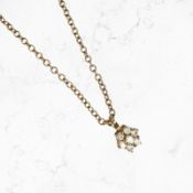 A 9ct gold moissanite pendant on 9ct gold chain CONDITION REPORT: 5g