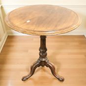 A mahogany tripod circular occasional table,