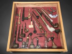 Three glazed montages of pipes, largest 50 cm x 50 cm.