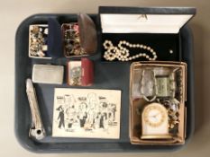 A group of costume jewellery including simulated pearls, panel bracelets, various brooches,