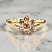 A 9ct gold garnet cluster ring, size Q CONDITION REPORT: 1.