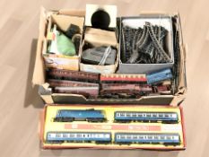 A collection of Tri-Ang 00 gauge rolling stock, track, buildings, power control unit.