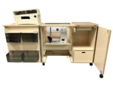 A sewing work station containing a Bernina Activa 140 digital sewing machine