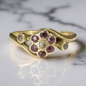 An antique 18ct gold ruby and diamond cluster ring,