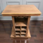 An Oceans Apart wooden table incorporating a bottle rack,