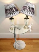 A chrome and glass lamp table and a pair of modern table lamps