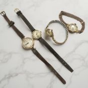 Four early 20th century lady's 9ct gold wristwatches; two on leather straps,