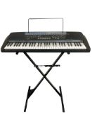 A Casio CT-700 digital keyboard with lead and keyboard stand.