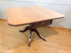 A reproduction inlaid mahogany sofa table in the Regency style,
