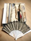 A group of hand fans including carved bone and mother of pearl examples.
