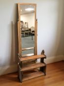 A mahogany cheval mirror and a three tier wall shelf