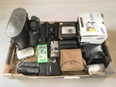 A group of digital cameras including Nikon, pair of Commodore 10x50 binoculars,