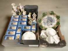 A group of porcelain bird ornaments in boxes, a pair of Miranda binoculars,