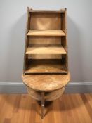 A mahogany two tier circular occasional table by Donald Russell and an oak shelf