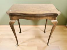 A reproduction burr walnut turnover top card table, on pad feet,