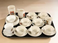 A group of Goss crested tea cups and saucers, beaker, etc.