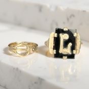 A 9ct gold buckle ring and a further black onyx signet ring CONDITION REPORT: 4.