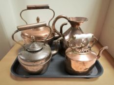 Three Victorian copper kettles and a harvest jug.