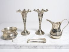 A pair of Iranian white metal and niello work trumpet vases, presentation dated 1933, height 19.