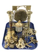 A brass gong, pair of candlesticks, bell, trivet, etc.