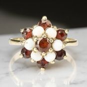 A 9ct gold garnet and opal cluster ring, size O CONDITION REPORT: 2.