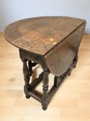A 19th century carved oak drop leaf gate leg dining table, extended 117 cm x 106 cm x 75 cm.