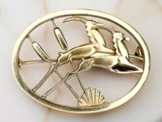 A 9ct gold leaping antelope brooch, designed by Geoffrey Bellamy for George Tarratt Ltd,