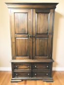 A stained hardwood double door wardrobe,