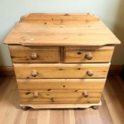 A modern pine four drawer chest,