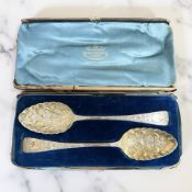 A pair of George III silver-gilt berry spoons, maker indistinct, London 1819 and 1832, length 22.