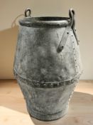 A galvanised metal twin-handled vessel, height 60 cm.