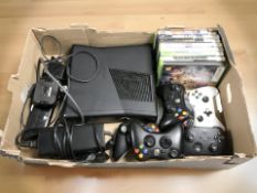 An Xbox 360 with leads, controllers, several games.