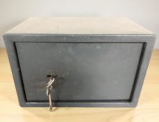 A small safe with key, width 31 cm.