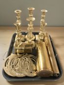 A group of Victorian brass candlesticks, plaques,