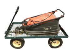 A garden cart and a Flymo electric mower