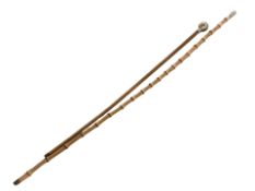 A Northumberland Fusiliers bamboo swagger stick and a further swagger stick.