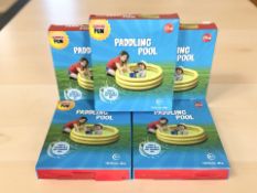 Five children's paddling pools in boxes.