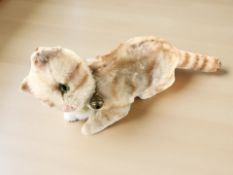 A Steiff Tabby Replica 1928 cat, with Steiff tag, length 22 cm.