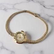 A lady's 9ct gold Elco wristwatch on 9ct gold integral bracelet CONDITION REPORT: